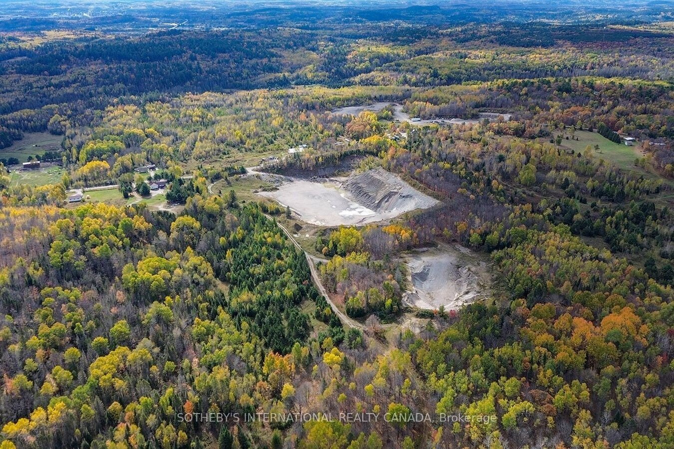 Aerial view of the quarry, pit and forested acreage at 251 Highway 17 in Baldwin, Ontario